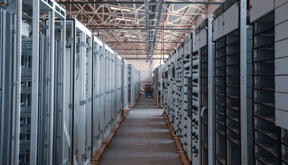 Rows of secured equipment cabinets in a data hall